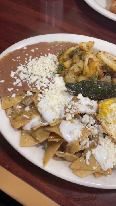 Rodeo Cafe - Green chilaquiles plate and a sausage breakfast sandwich for the hubby - Breakfast & Brunch Near Me - Corona, California