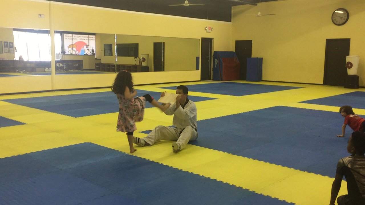 Kims White Tiger - Brielle breaking the board - Martial Arts Near Me - Houston, Texas