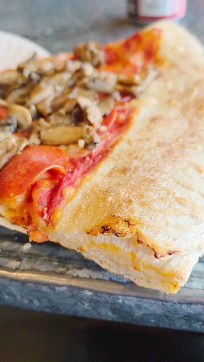 Benny Adelinas - A Video Clip of a Virginia Slice of Pepperoni and Mushroom Pizza in Close-up. - Pizza Near Me - Hardy, Virginia