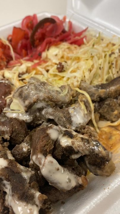 Sabor a Honduras - A thick layer of bananas with extremely old, dried beef. - Honduran Near Me - Austin, Texas