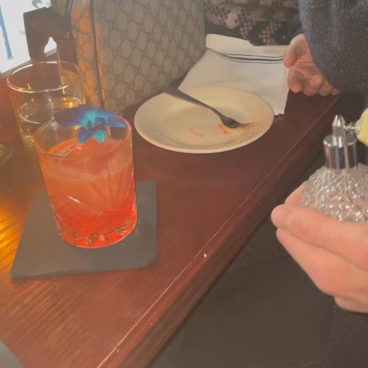 The Headless Widow - Spritzing some mezcal on the Mary poppins - Cocktail Bars Near Me - New York, New York