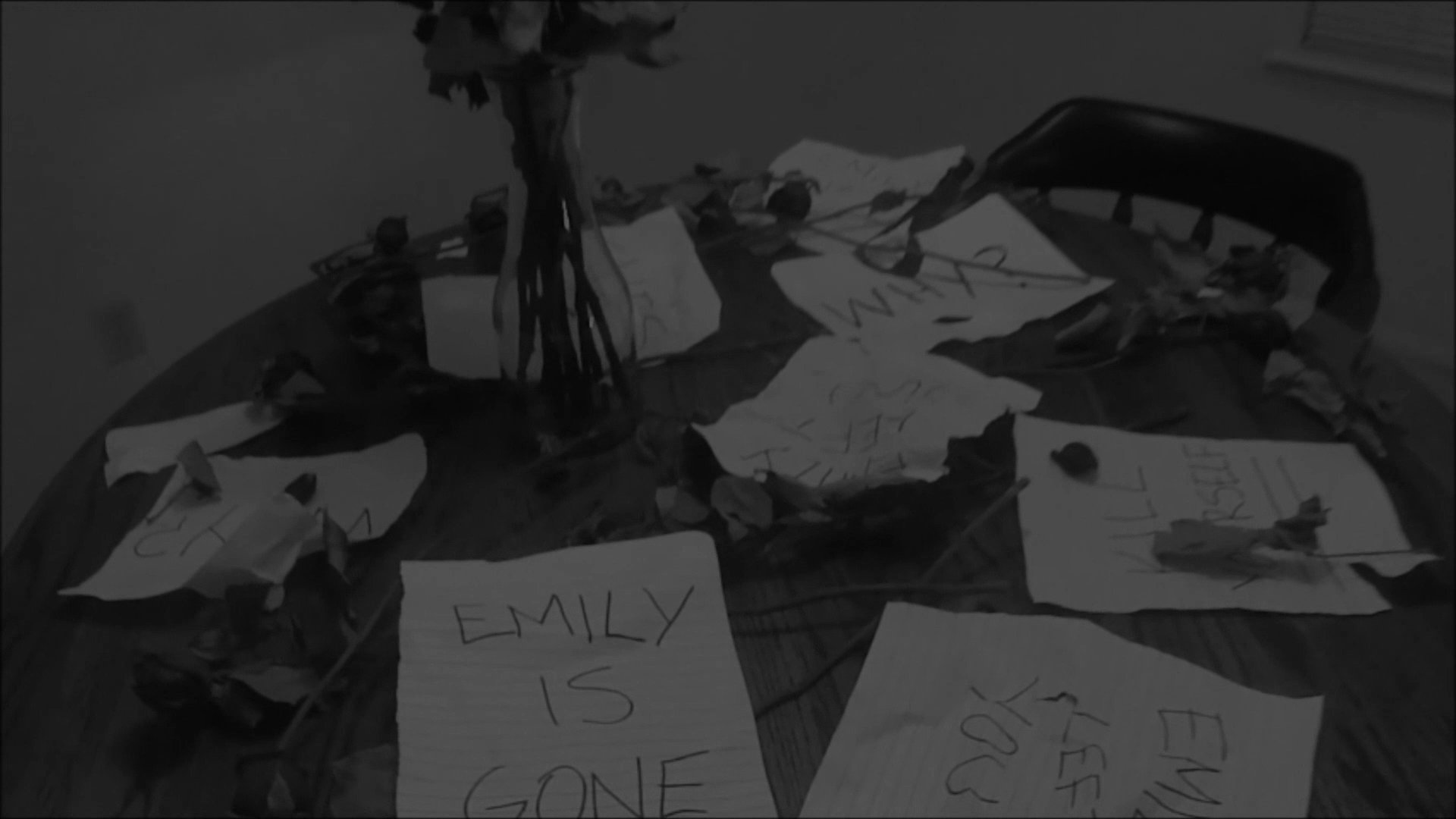 A man experiences profound sorrow in a dimly lit room, surrounded by scattered notes expressing loss and wilted roses. He contemplatively interacts with the mementos, highlighting themes of heartbreak and solitude.