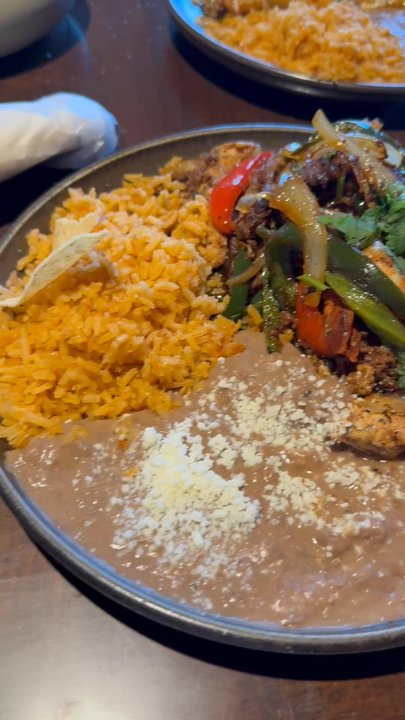 Santoro - One dish is the ultimate trio fajitas, absolutely delicious!  So incredibly flavorful. Also Cowboy Enchiladas .... Fabulous. - Mexican Near Me - Omaha, Nebraska