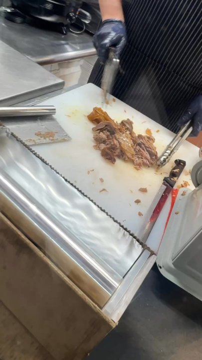 Carnitas Premium - Video of carnitas an cueros chopped up for tacos - New Mexican Cuisine Near Me - Bakersfield, California