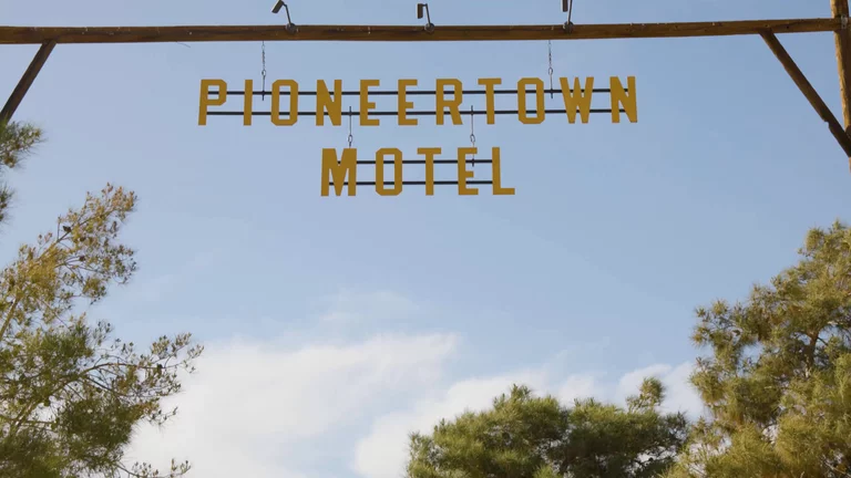 Pioneertown Motel sign blowing in the wind