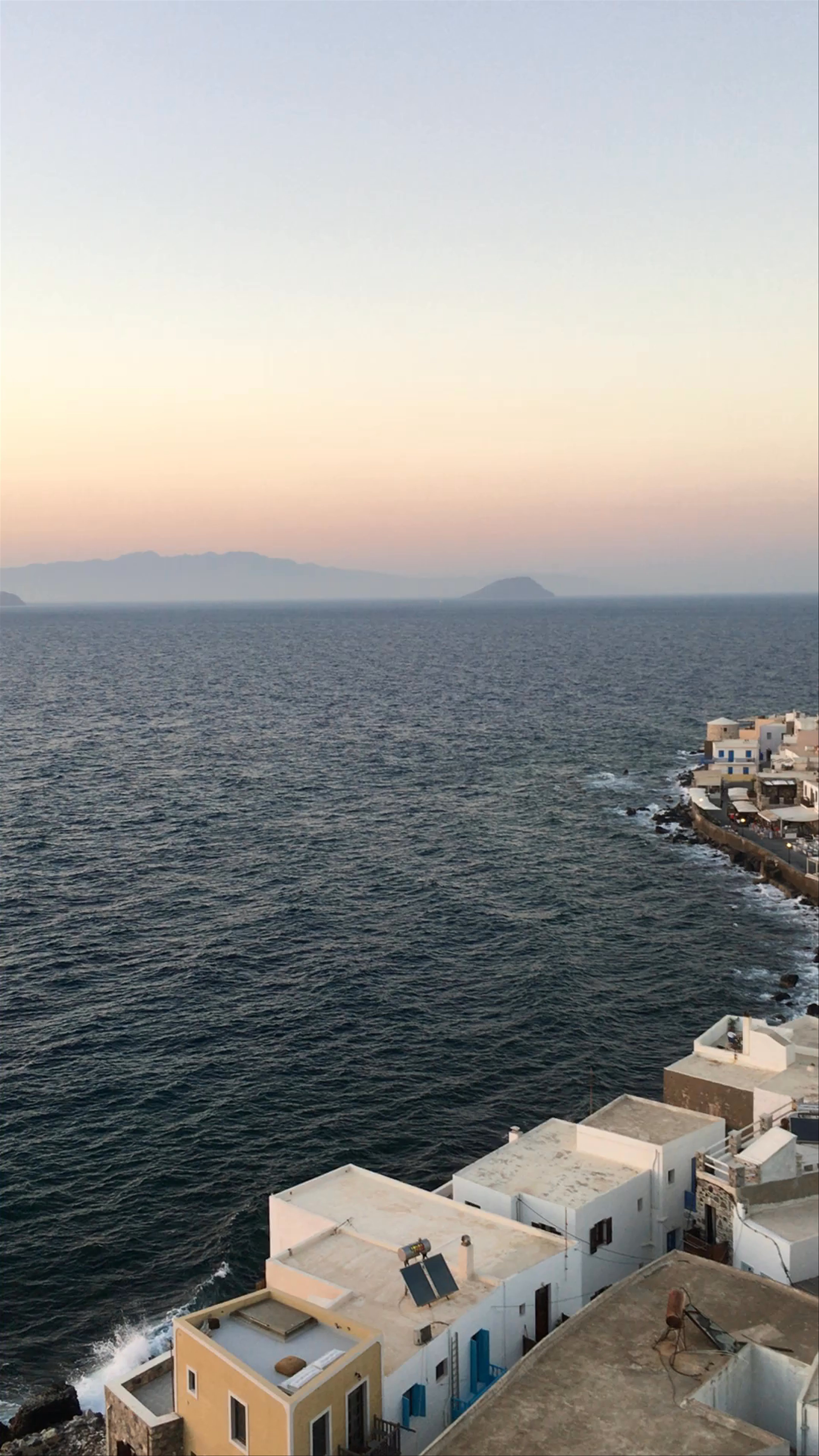 Mandraki Harbor Serenity: A Sunset Stroll on Rhodes Island