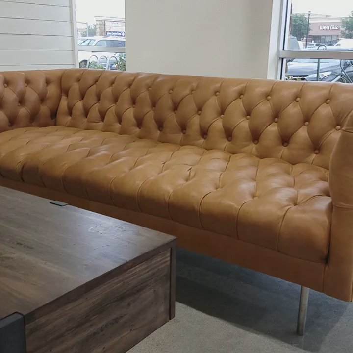 Main Squeeze Juice Co. - Comfy couch in front of giant art on the wall - Juice Bars & Smoothies Near Me - Katy, Texas