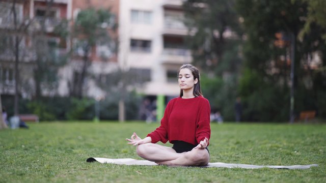 Meditating outdoors in the park