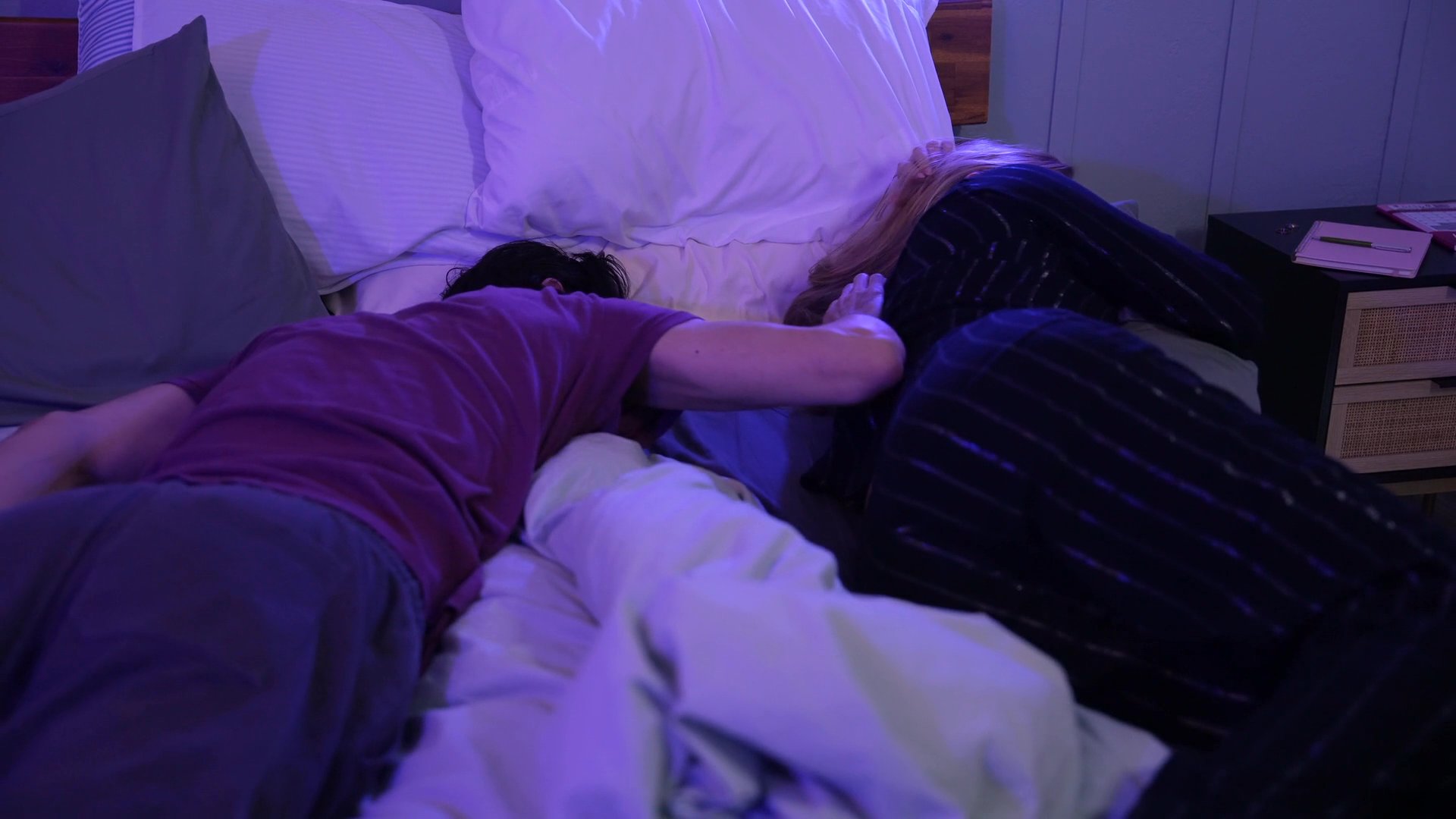 A couple spends quiet time together in a bedroom before shifting to scenes of driving and rest, capturing moments of personal connection and daily activity.