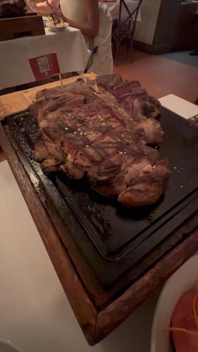Trattoria Dalloste - Sizzling steak right from the grill. - Tuscan Near Me - Florence, FI