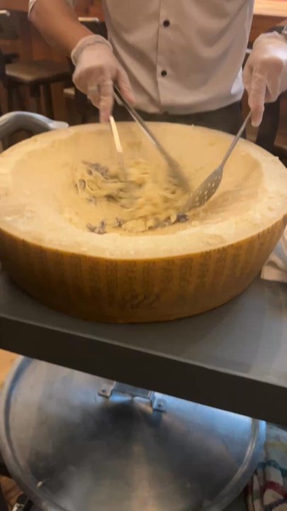 Garlic & Olive Pasta Eats - They bring the Parmesan wheel to the table and mix the tagliatelle funghi in the wheel and then serve. Creamy and delicious! - Italian Near Me - Brooklyn, New York