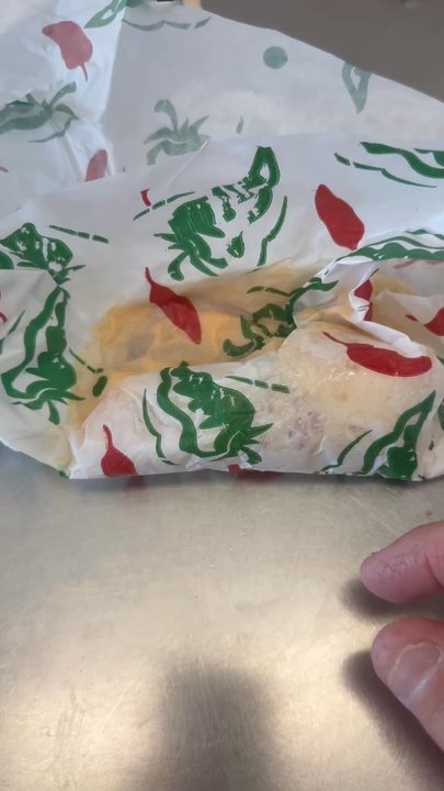 Taco Delite - Taco stuck to wrapper. Half the cheese on the wrapper - Mexican Near Me - Plano, Texas