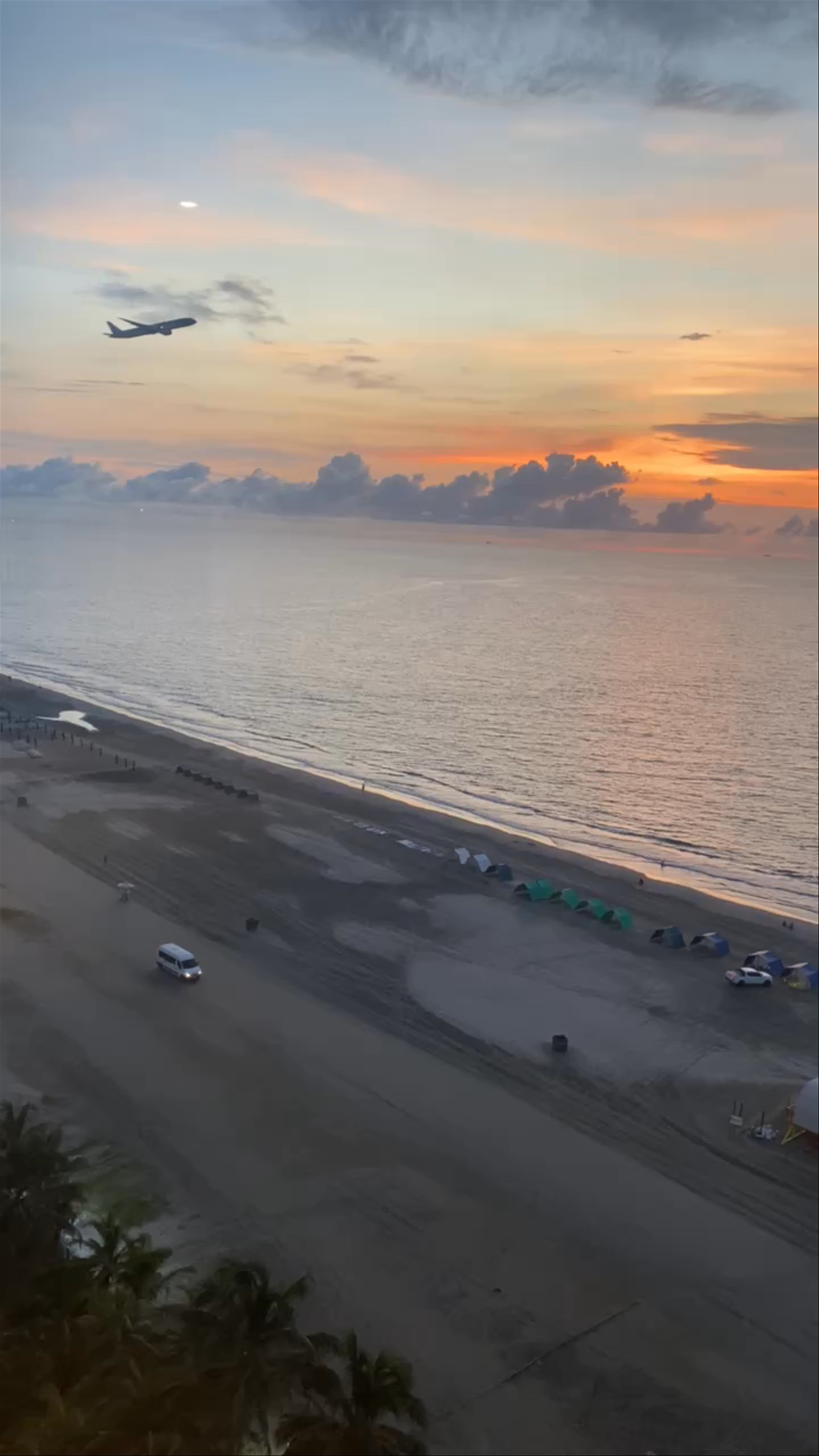 Sunset Serenity and Airplane Takeoff at Cartagena's Morros Beach