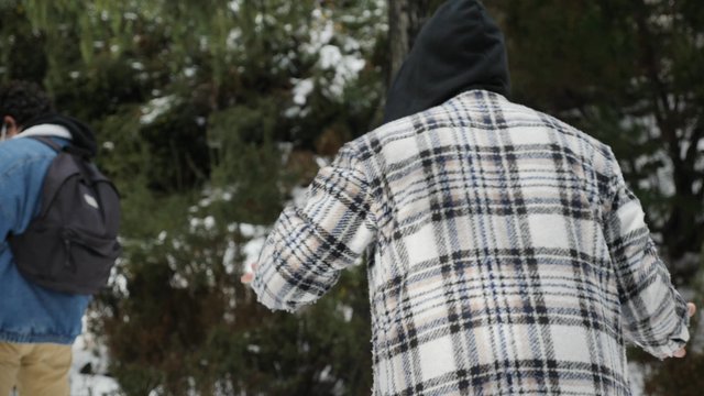 Putting snow down someone's shirt