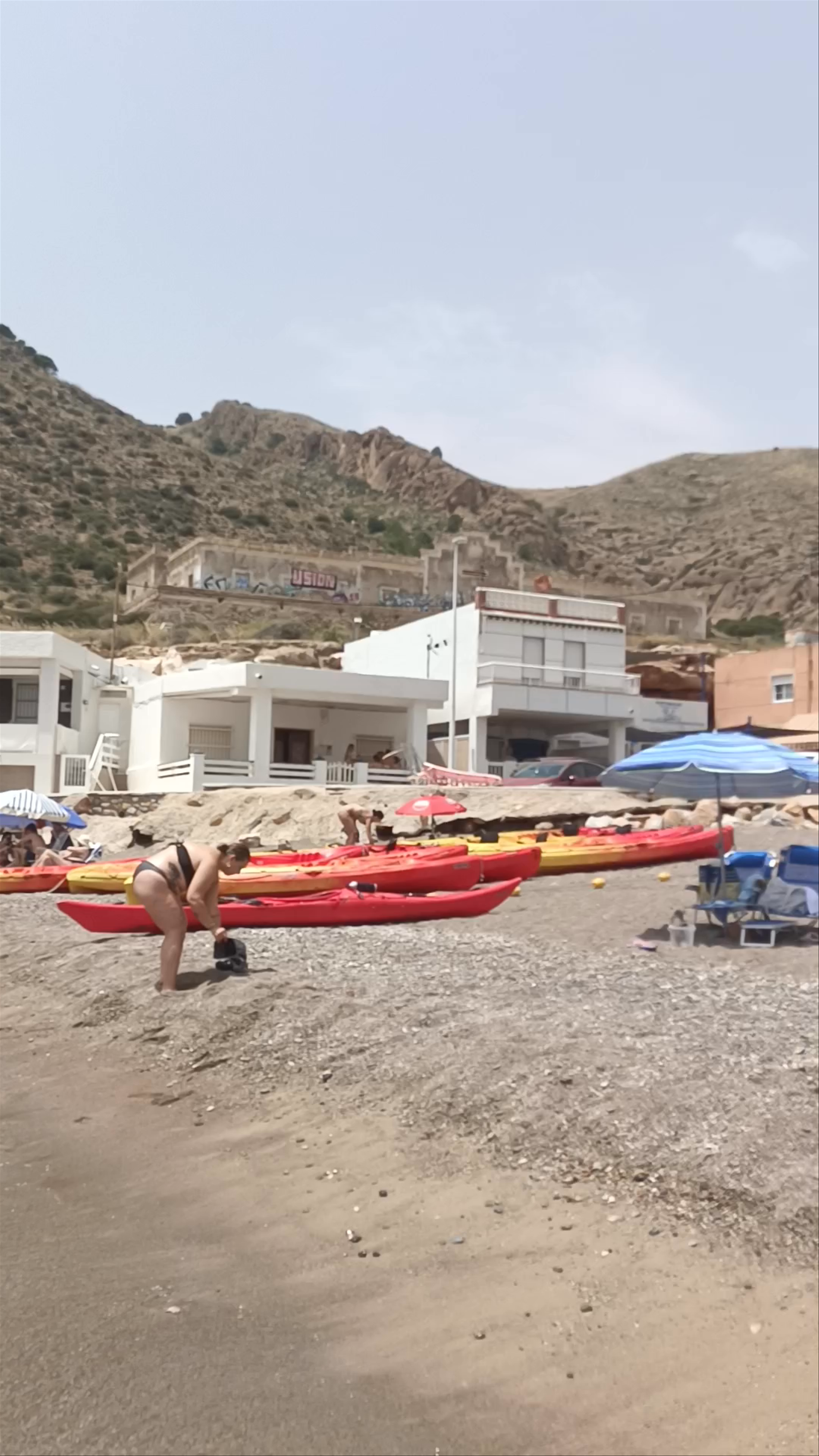 Sun-Kissed Fun at Playa de Portús, Spain