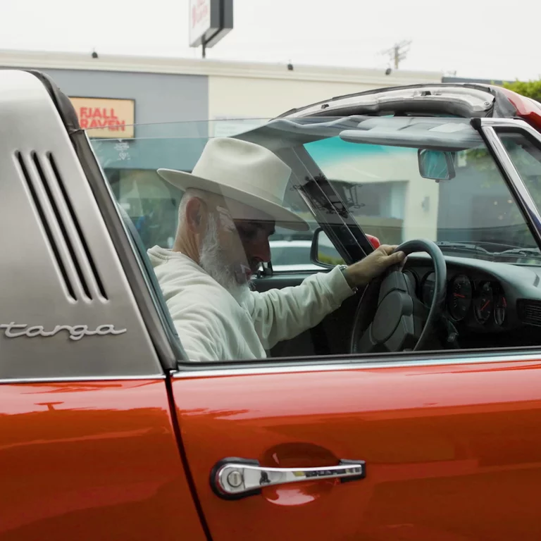 Man sitting in vintage car