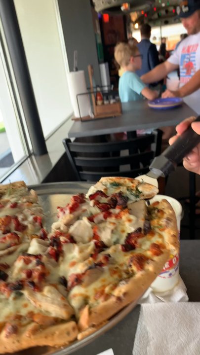 Lost Pizza - We got a medium pizza with pesto sauce, sun dried tomatoes, spinach, chicken, and roasted garlic. That cheese pull was a m a z i n g - Pizza Near Me - Fort Walton Beach, Florida