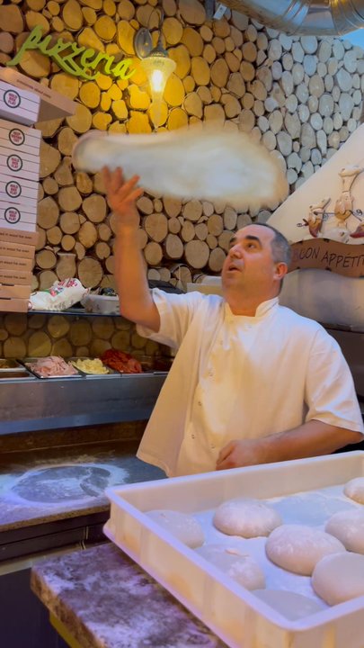 La Vita E Bella - Owner tossing the pizza - Italian Near Me - London, XGL