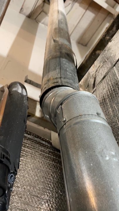 Guardian Roofs - Rainwater dripping down flue vent - Roofing Near Me - Orange, California