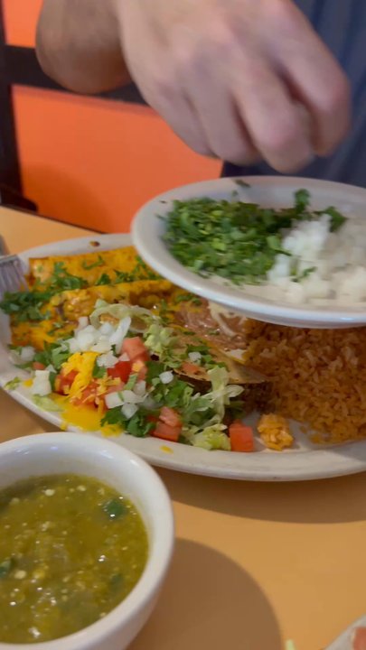 El Rincon - Dressing up the Mexican plate with lots of cilantro and onion - Mexican Near Me - Pflugerville, Texas