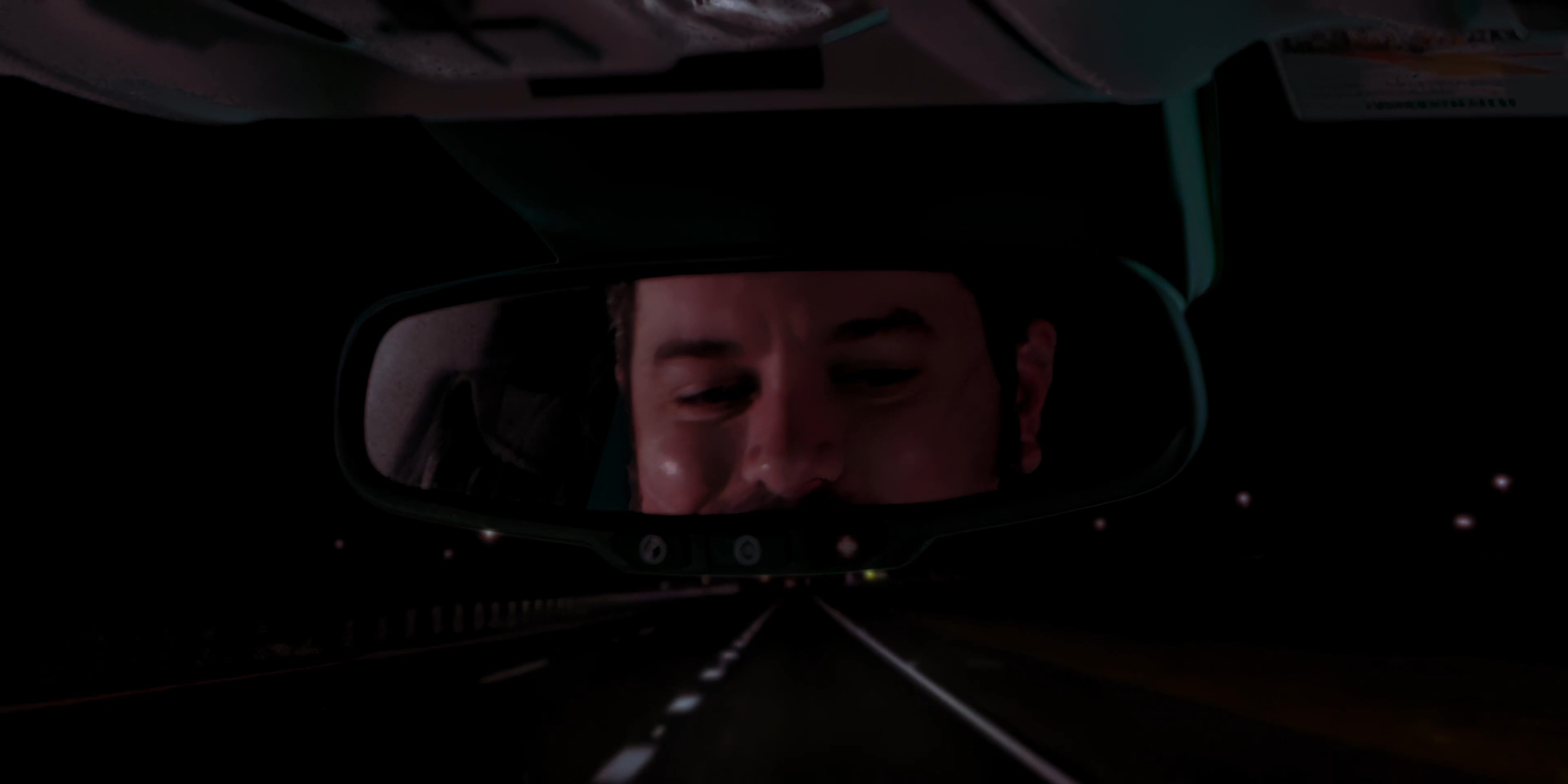 A rideshare driver interacts with a passenger while receiving an incoming call on his mounted smartphone during a nighttime drive. The driver transitions from conversation to managing the active call while navigating the vehicle.