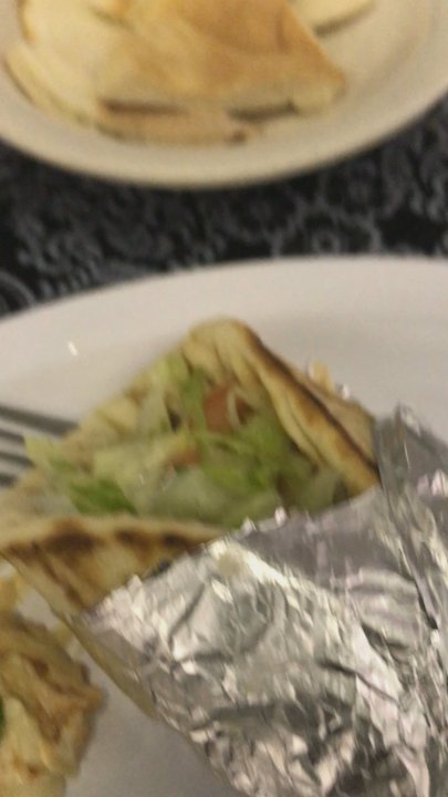 Zaina - Beef Gyro sandwich with hummus topped with a red pepper olive oil mix. *mouth watering at the memory* - Mediterranean Near Me - Kansas City, Missouri