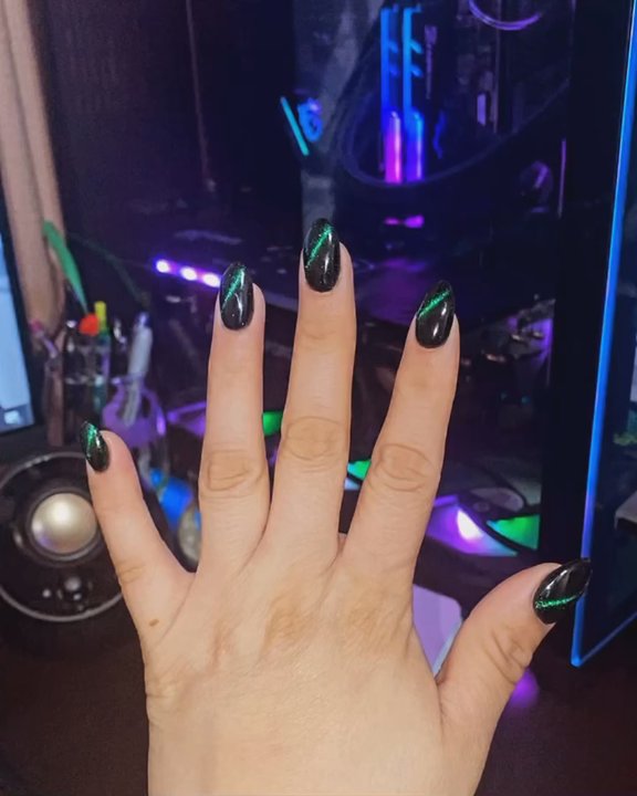 Montrose Nails - I really recommend Ivy she is great. Black powder and on top of that it's green cat eye design. - Nail Salons Near Me - Houston, Texas