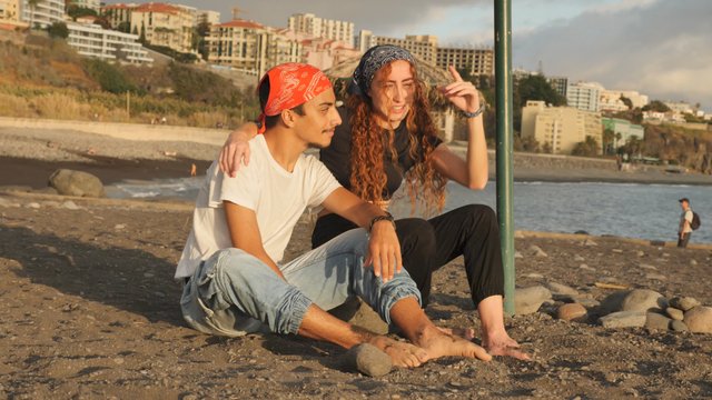 Couple sitting on the beach