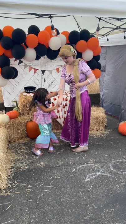 Classic Princess Parties - Rapunzel playing with this little mermaid at a pop up - Party Characters Near Me