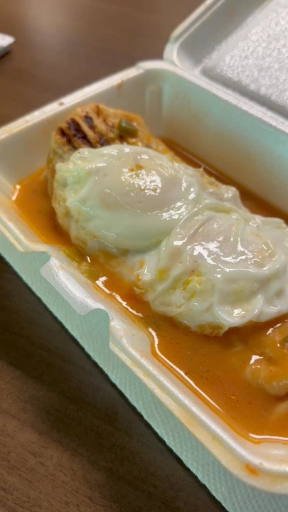 Riccos Burritos - Badger burrito with sausage. Not quite sure why the eggs are on top - Mexican Near Me - Denver, Colorado