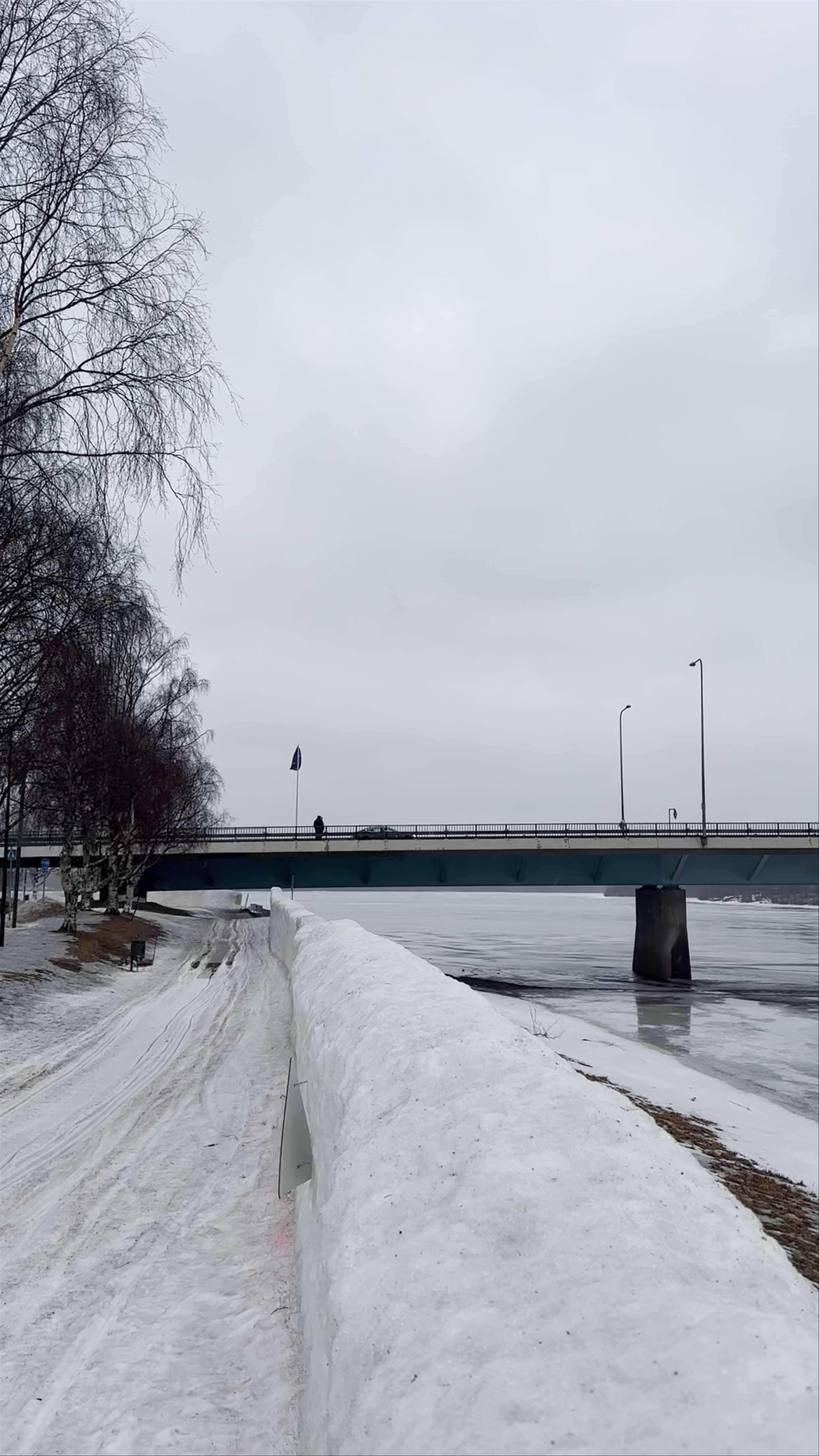 Lumberjack's Candle Bridge in Winter – Rovaniemi's Serene Frozen Landscape