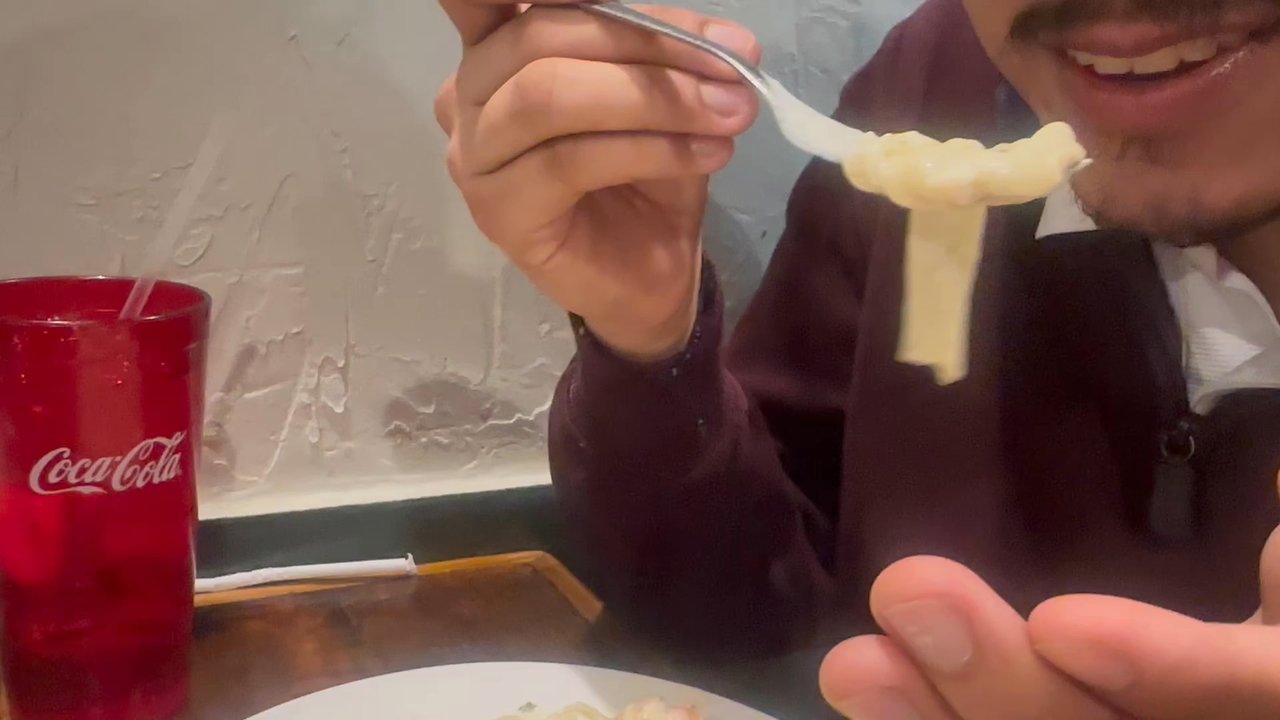 Little Italy - blowing into the hot alfredo! - Italian Near Me - Tyler, Texas