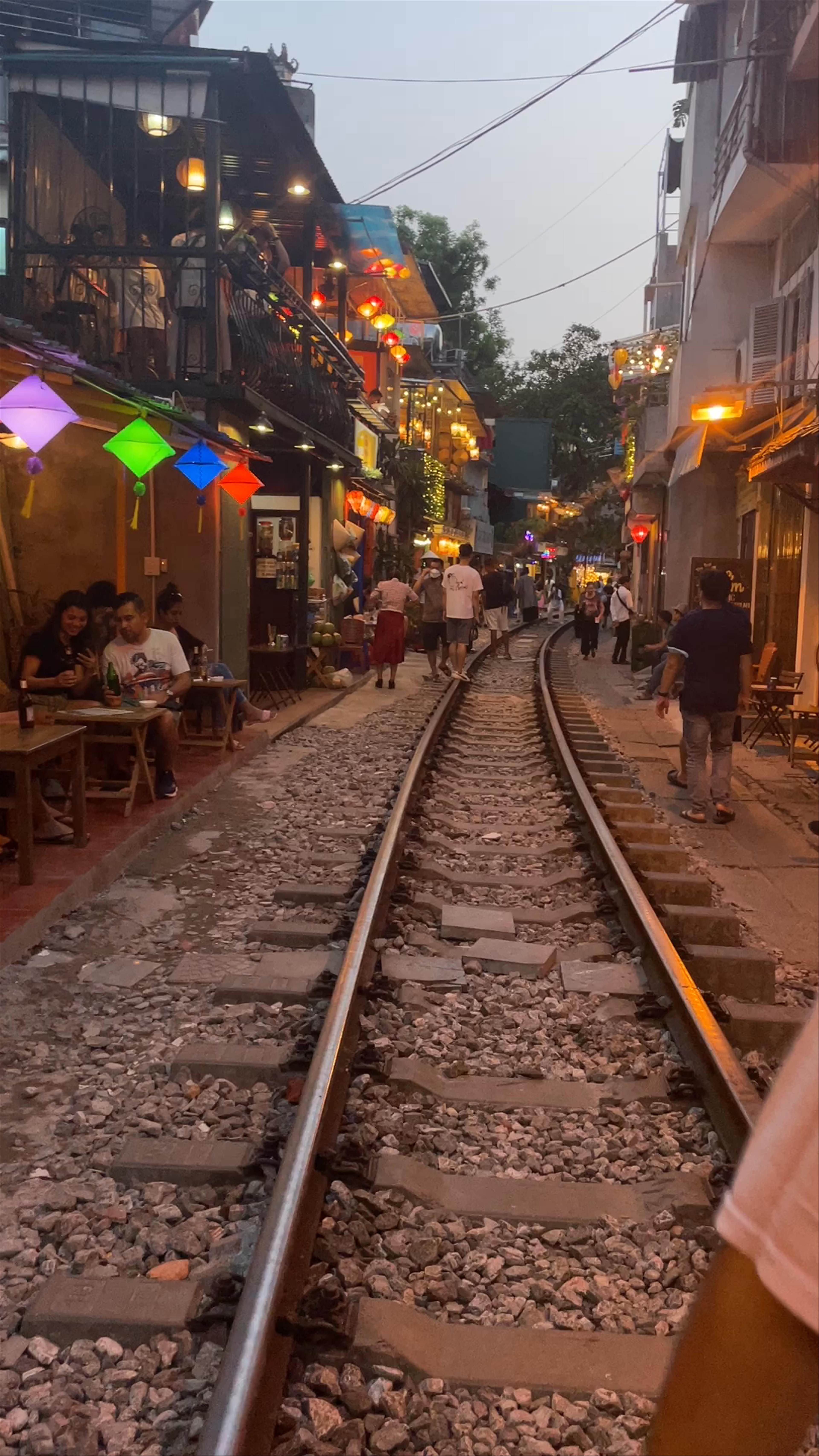 Hanoi Train Street: Vibrant Evening Along the Tracks