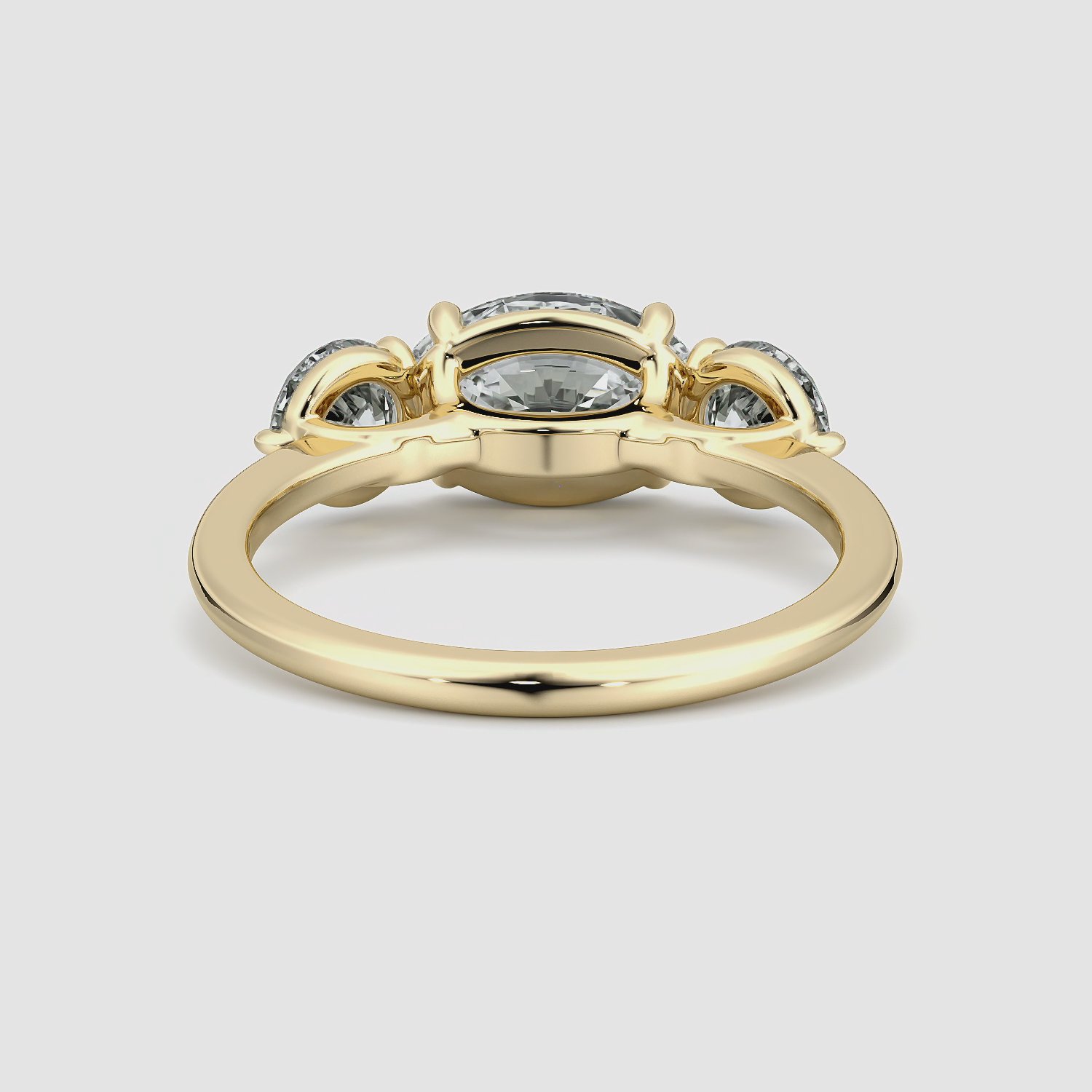 The Three Stone | Oval | 18k | Yellow Gold | bandAccent: Plain | diamondOrientation: horizontal | sideStoneCarat: 0.50ct | sideStoneShape: Round Brilliant | caratWeight: other