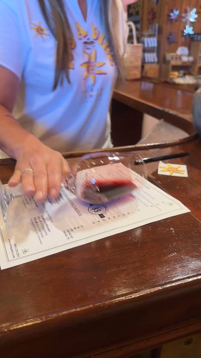 Tobin James Cellars - Assessing the wine's color by pouring the perfect amount into the glass and rolling it on its side without spilling. - Wineries Near Me - Paso Robles, California