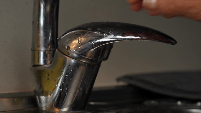 Woman rinsing her hands