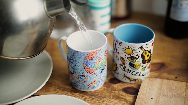 Pouring boiling water into a mug