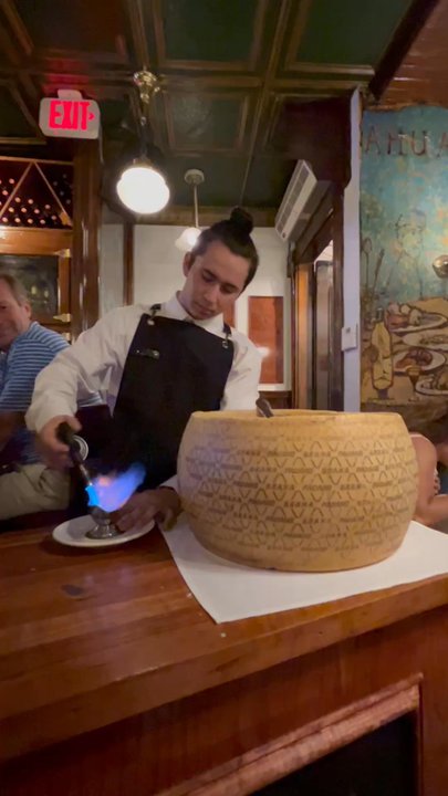 Villa Francesca - Guy finishing Alfredo pasta in cheese bowl - Italian Near Me - Boston, Massachusetts