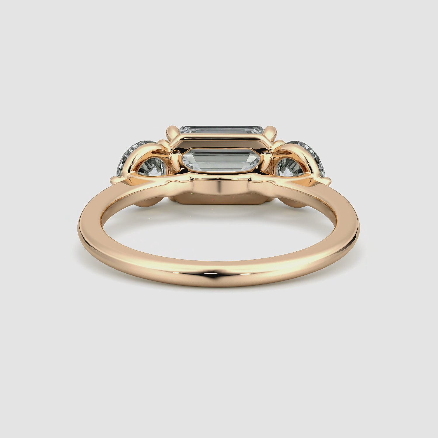 The Three Stone | Emerald | 14k | Rose Gold | bandAccent: Plain | diamondOrientation: horizontal | sideStoneCarat: 0.50ct | sideStoneShape: Round Brilliant | caratWeight: other