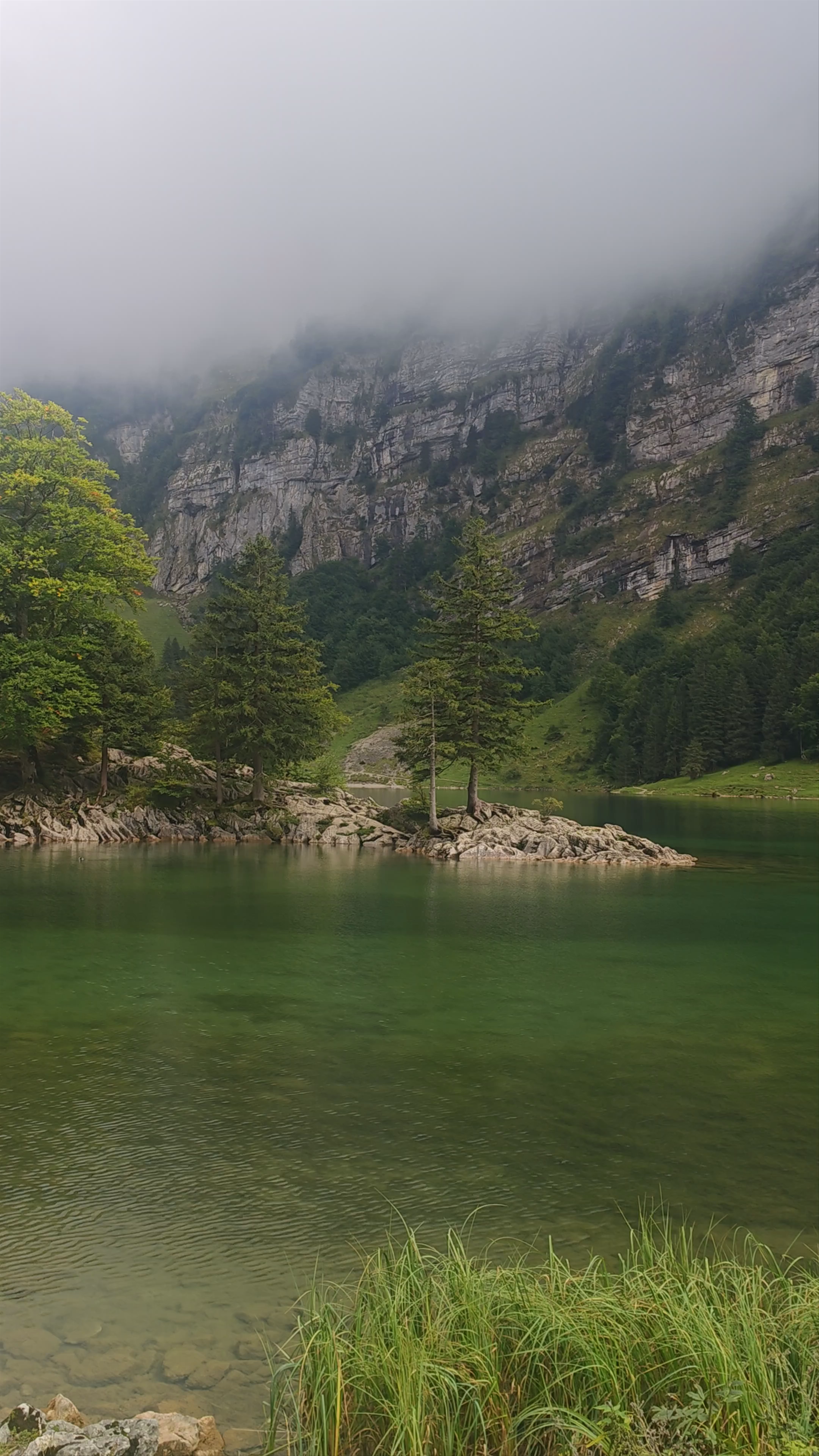 Misty Morning Serenity at Seealpsee Lake, Switzerland