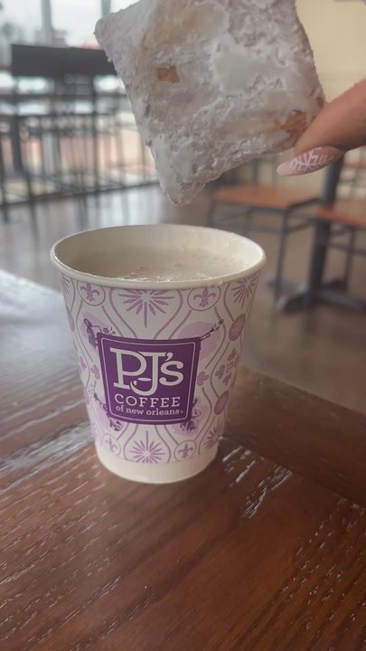 PJ's Coffee - Dipping the Beignet in the Pralines & Cream Latte - Coffee & Tea Near Me - Dallas, Texas