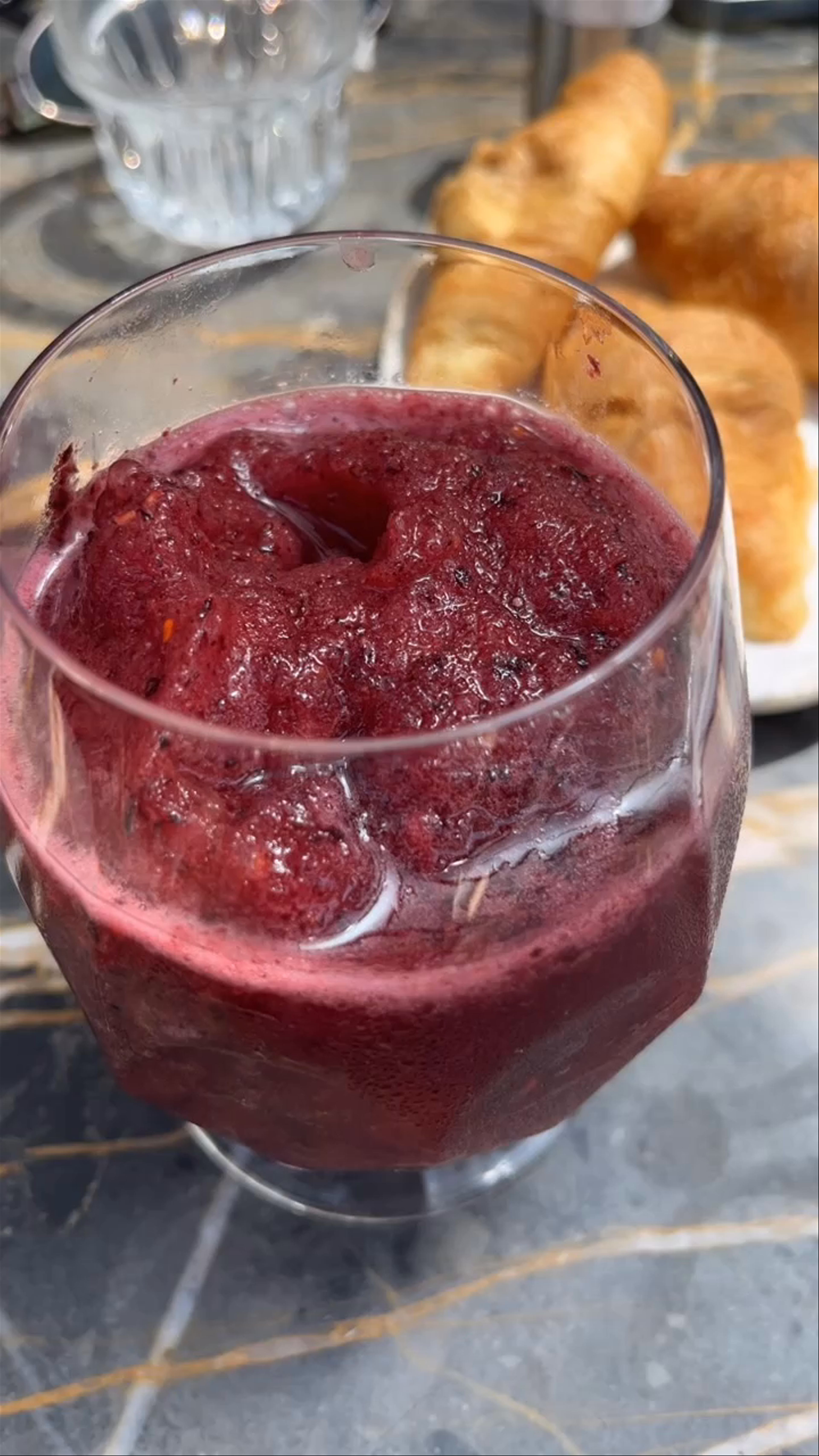 Chilled Berry Smoothie and Croissants at a Sunny Thessaloniki Cafe