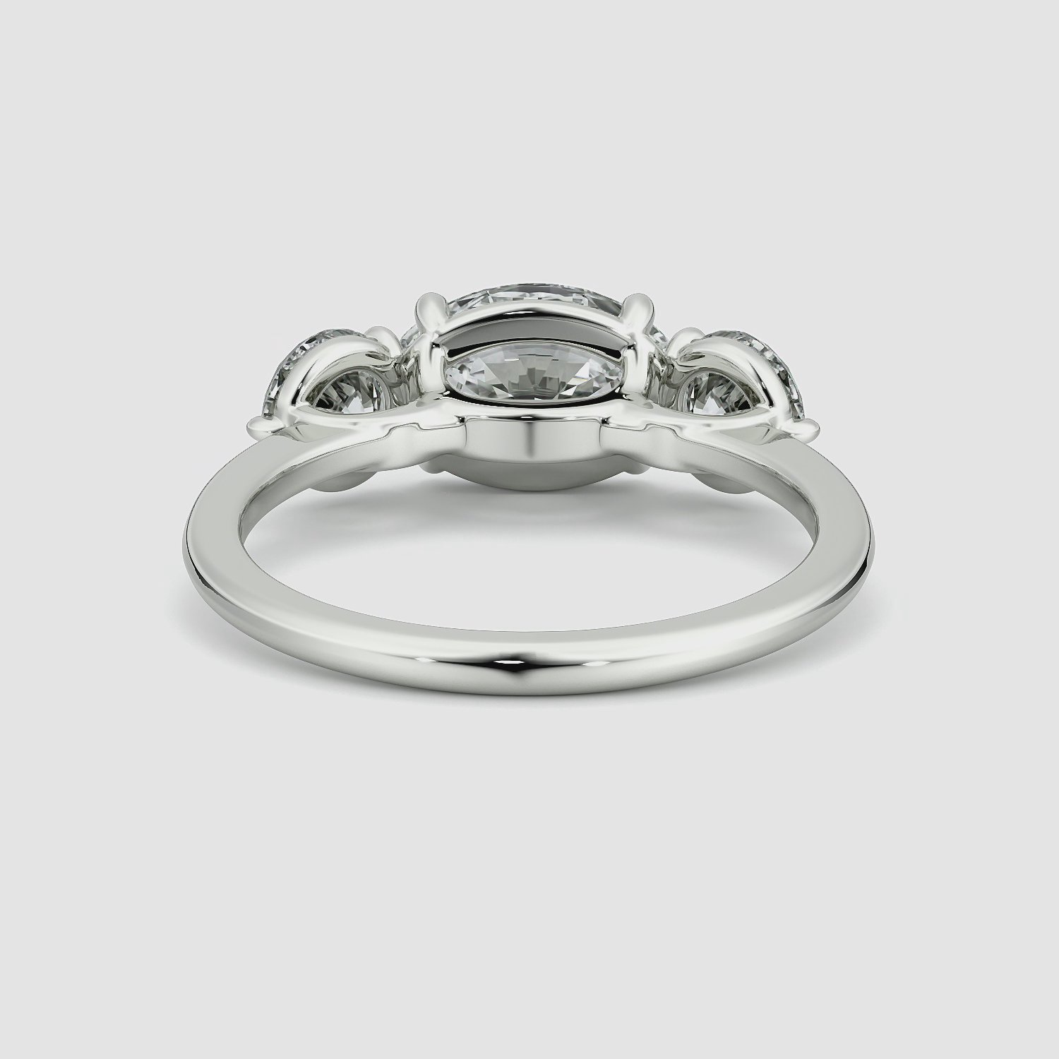 The Three Stone | Oval | 18k | White Gold | bandAccent: Plain | diamondOrientation: horizontal | sideStoneCarat: 0.50ct | sideStoneShape: Round Brilliant | caratWeight: other