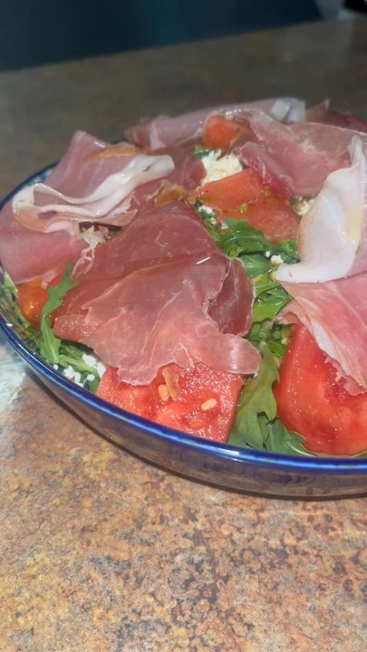Atmosphere - Watermelon salad with arugula, goat cheese, and white wine reduction - Italian Near Me - Sarasota, Florida