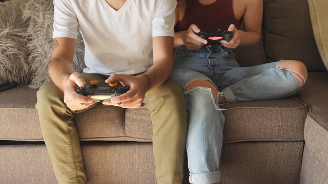 Man and woman playing video games