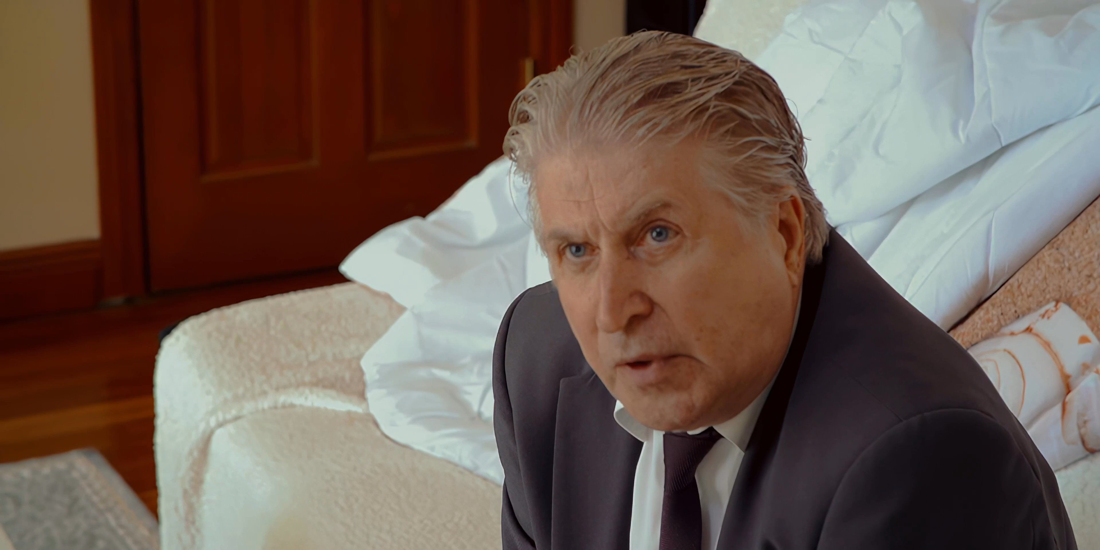Two men engage in a high-tension, emotionally charged confrontation. Their heated interaction highlights an intense interpersonal conflict within an indoor setting.