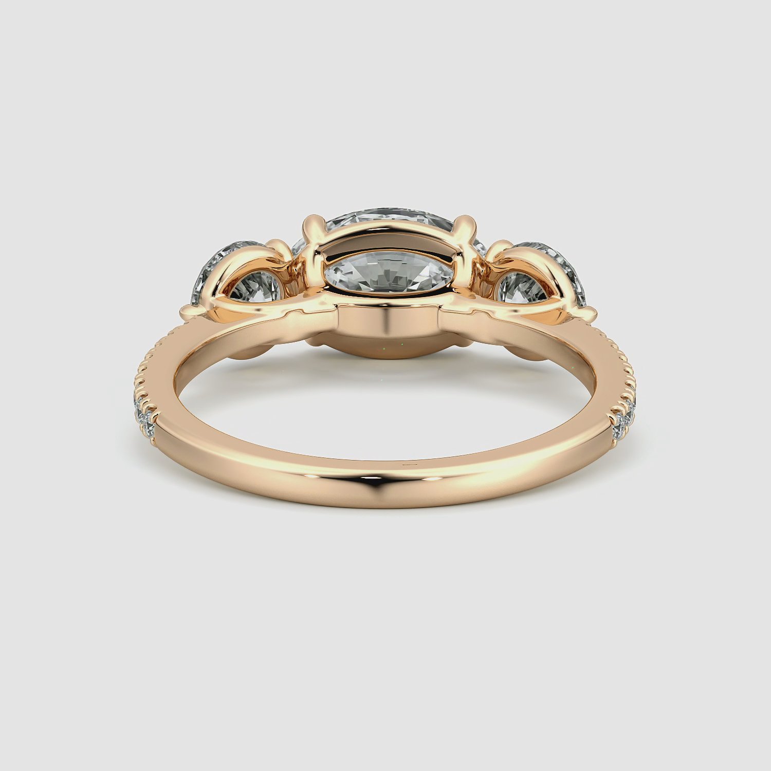 The Three Stone | Oval | 14k | Rose Gold | bandAccent: Pavé | diamondOrientation: horizontal | sideStoneCarat: 0.50ct | sideStoneShape: Round Brilliant | caratWeight: other