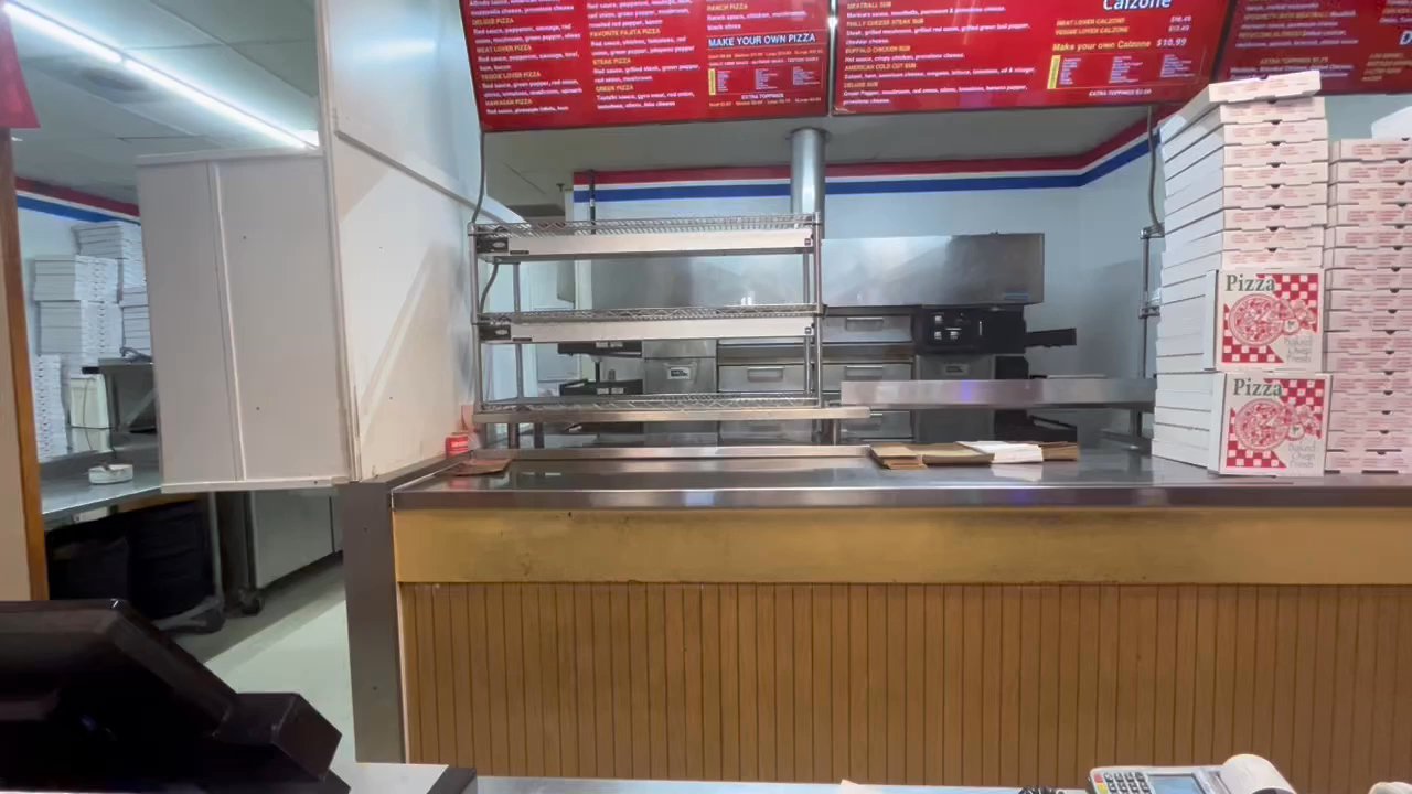 Eat Pizza - No customer service at the front. Solo cashier/cook working orders in the back. - Pizza Near Me - Springfield, Virginia