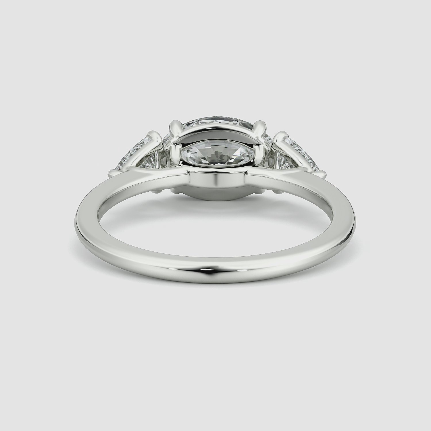 The Three Stone | Oval | Platinum | bandAccent: Plain | diamondOrientation: horizontal | sideStoneCarat: 0.25ct | sideStoneShape: Trillion | caratWeight: other