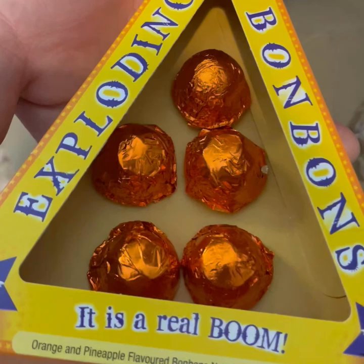 Honeydukes - Exploding Bonbons~ Delicious or should I say oh SoO addicting orange & pineapple, white chocolate bonbons, have Pop Rocks inside! - Candy Stores Near Me - Orlando, Florida